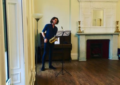 saxophonist Gavin Mungersdorf performing a commissioned piece